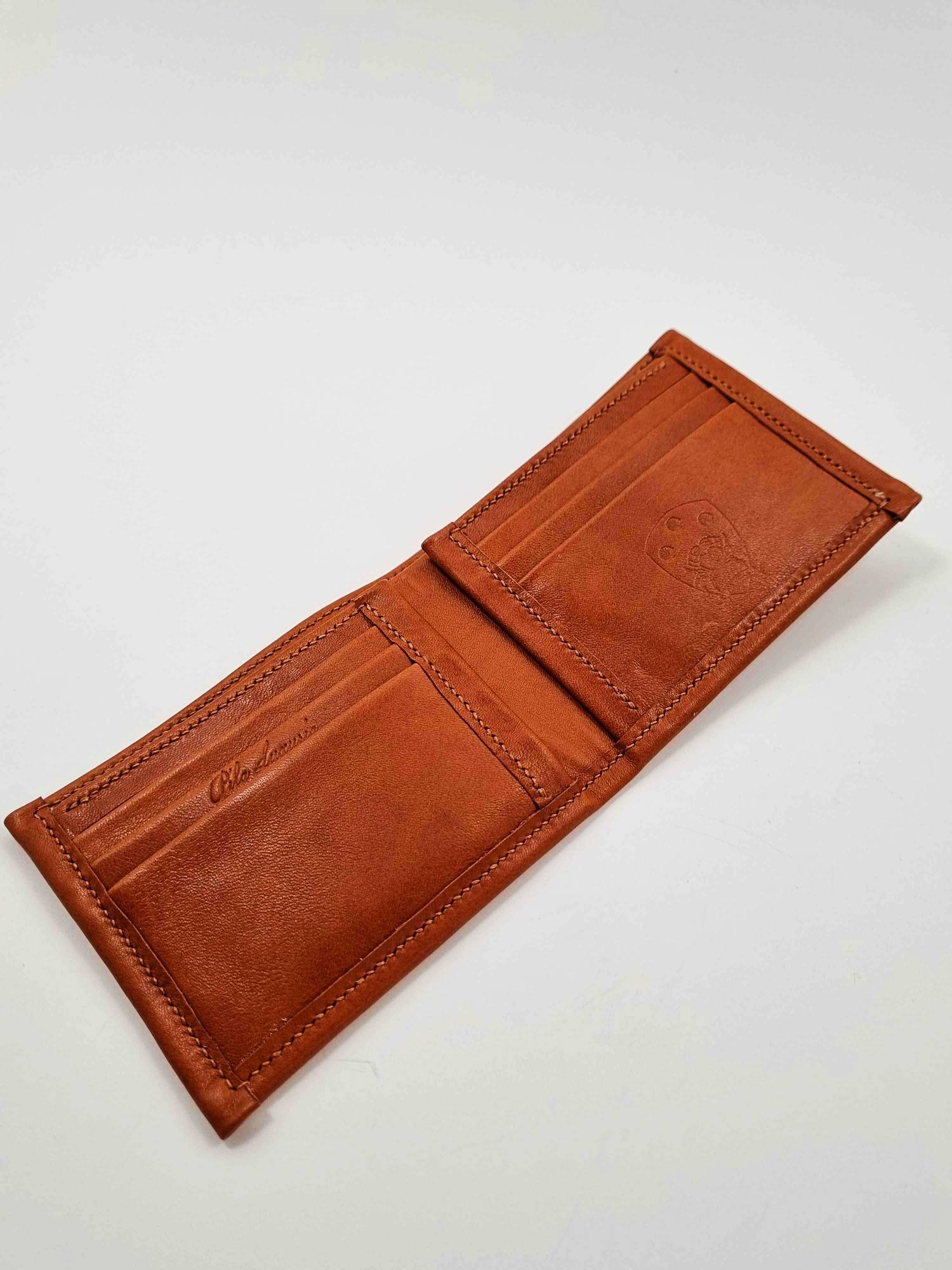 Brown leather wallet laying flat showing card slots
