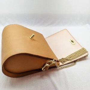 A biscuit colored epsom leather purse made by Pila Luxuria in Alberta, Canada laid open.