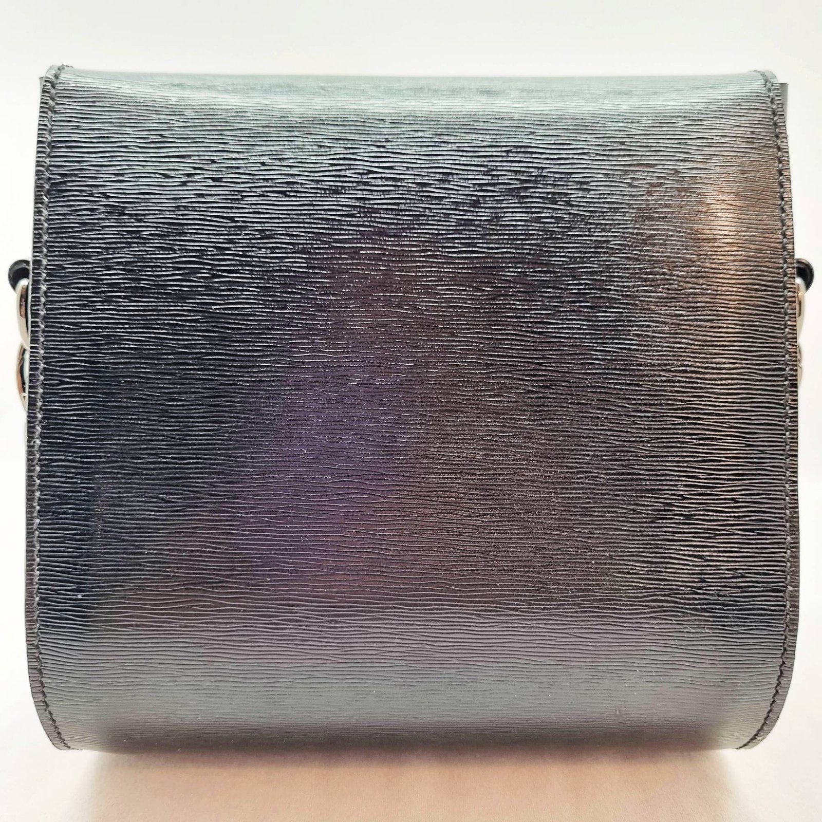 A black epi leather purse made by Pila Luxuria in Alberta, Canada displayed from the rear.