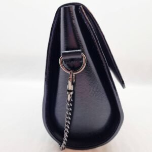 A black epi leather purse made by Pila Luxuria in Alberta, Canada displayed from the side.