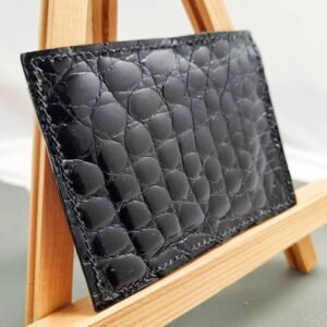 Black mirror finish crocodile leather card holder made by Pila Luxuria in Canada shown from the back.