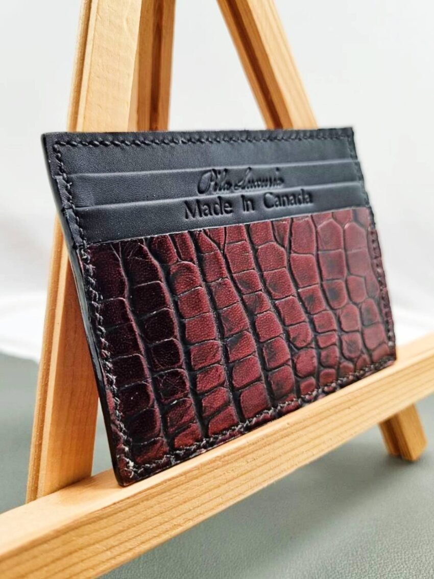 Angled view of a luxury alligator leather card holder, made by Pila Luxuria in Canada.