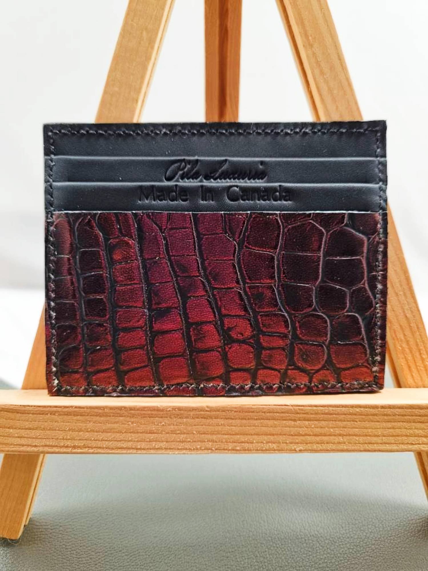 Front view of a luxury alligator leather card holder, made by Pila Luxuria in Canada.