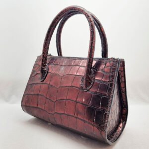 An exotic red alligator leather handbag made by Pila Luxuria in Alberta, Canada shown from the rear angle.