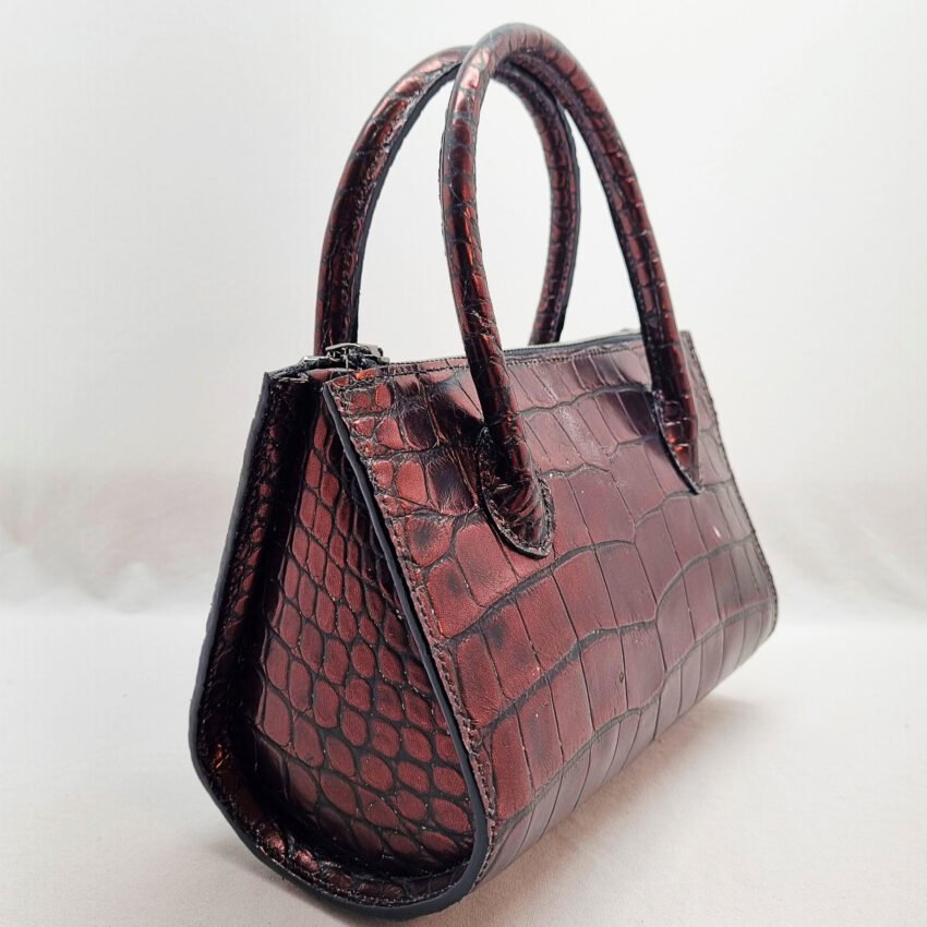 An exotic red alligator leather handbag made by Pila Luxuria in Alberta, Canada shown from another rear angle.