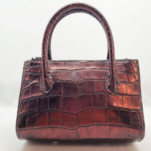 An exotic red alligator leather handbag made by Pila Luxuria in Alberta, Canada shown from the back.