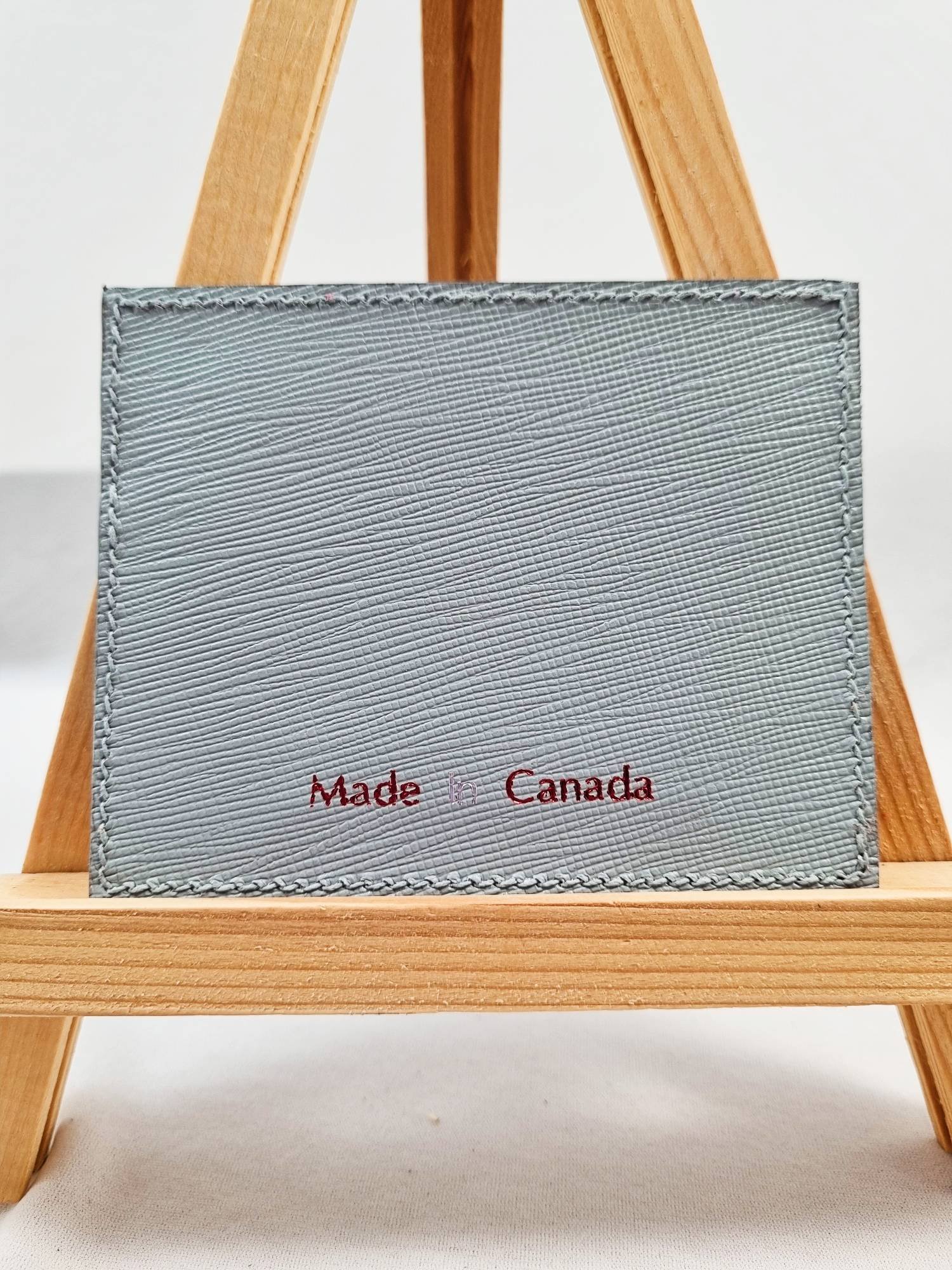 Grey saffiano calfskin wallet with Made in Canada text
