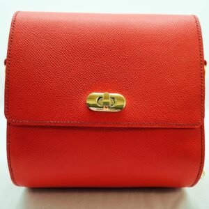 A rouge colored epsom leather purse made by Pila Luxuria in Alberta, Canada displayed from the front.
