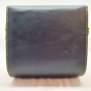 A black and yellow epsom leather purse made by Pila Luxuria in Alberta, Canada displayed from the back.