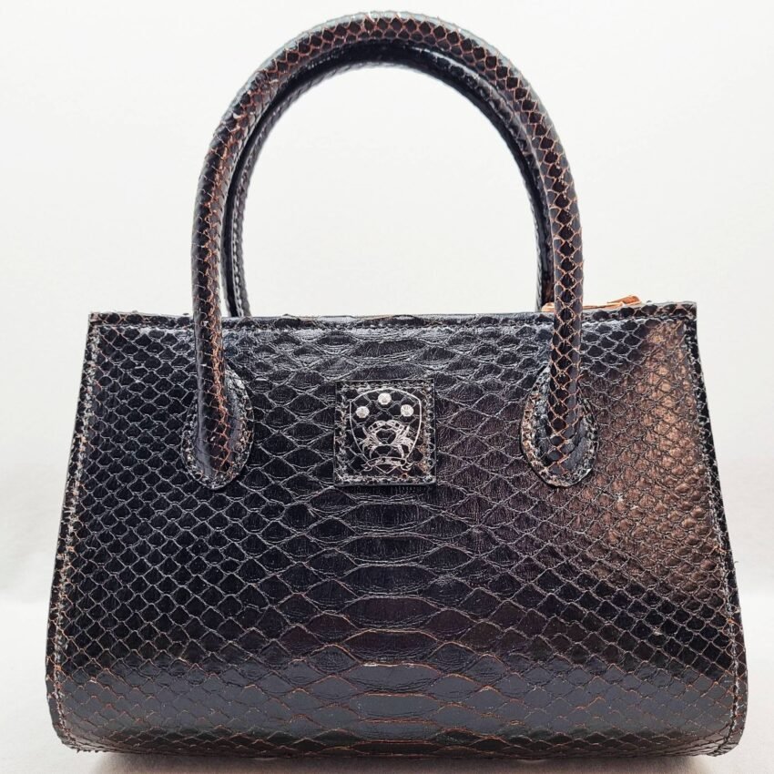 An exotic black python leather handbag made by Pila Luxuria in Alberta, Canada shown from the front.