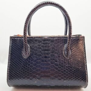 An exotic black python leather handbag made by Pila Luxuria in Alberta, Canada shown from the back.