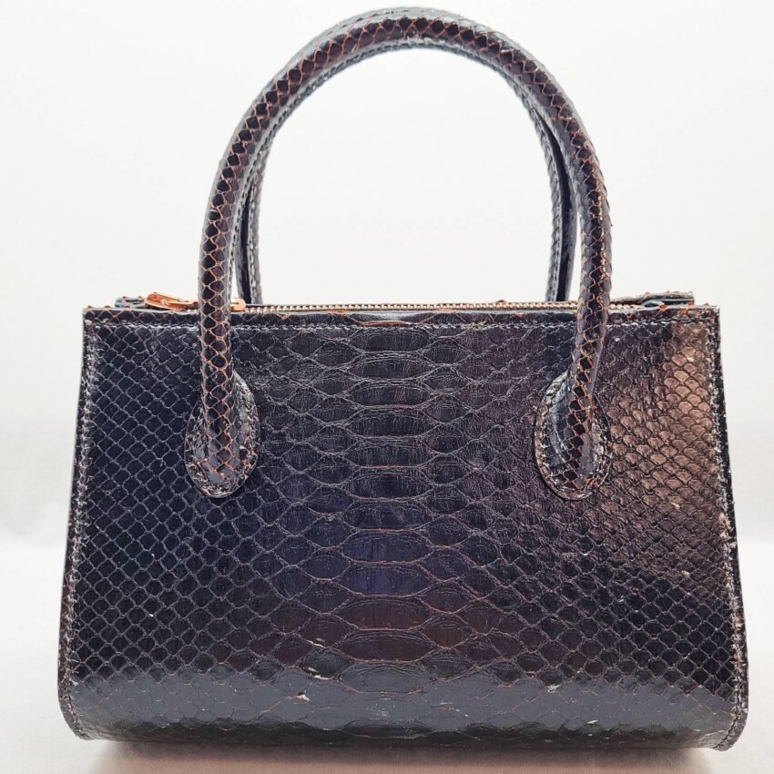 An exotic black python leather handbag made by Pila Luxuria in Alberta, Canada shown from the back.