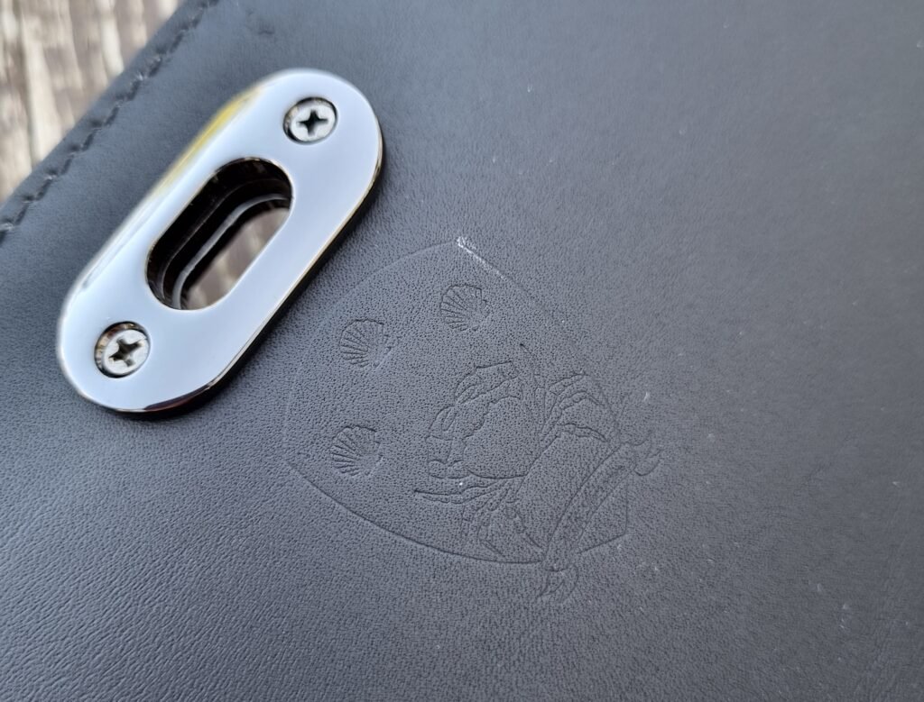 Pila Luxuria logo on a black Epi leather purse