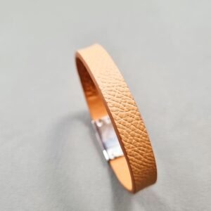 Angled view of a luxury biscuit epsom leather bracelet with a magnetic clasp, made by Pila Luxuria in Canada.