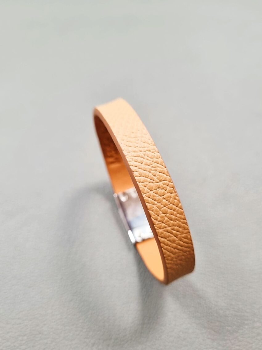 Angled view of a luxury biscuit epsom leather bracelet with a magnetic clasp, made by Pila Luxuria in Canada.