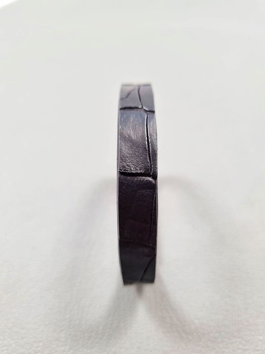 Forward view of a luxury black crocodile leather bracelet with a magnetic clasp, made by Pila Luxuria in Canada.