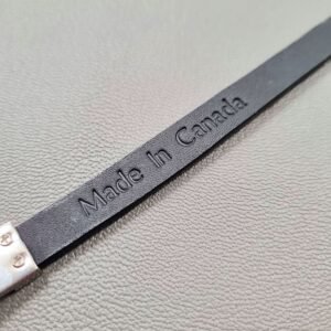Made In Canada logo of a luxury black crocodile leather bracelet with a magnetic clasp, made by Pila Luxuria in Canada.