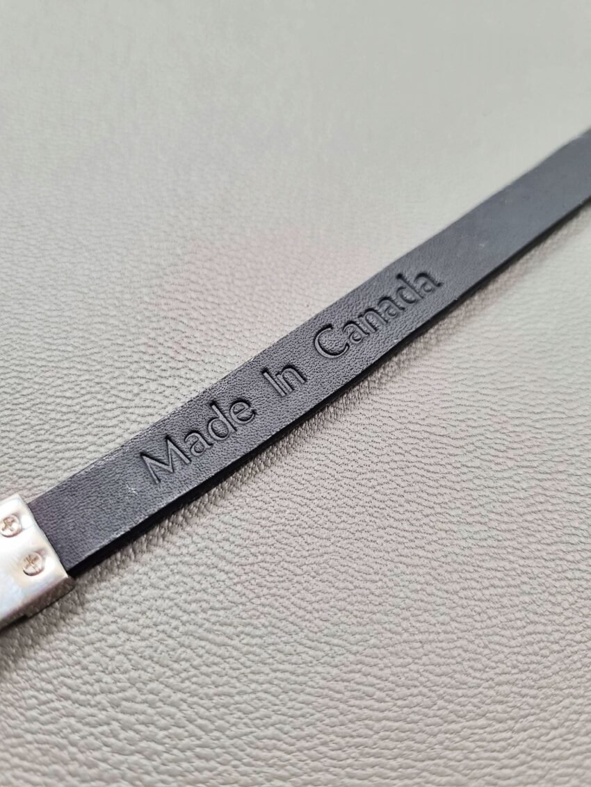 Made In Canada logo of a luxury black crocodile leather bracelet with a magnetic clasp, made by Pila Luxuria in Canada.