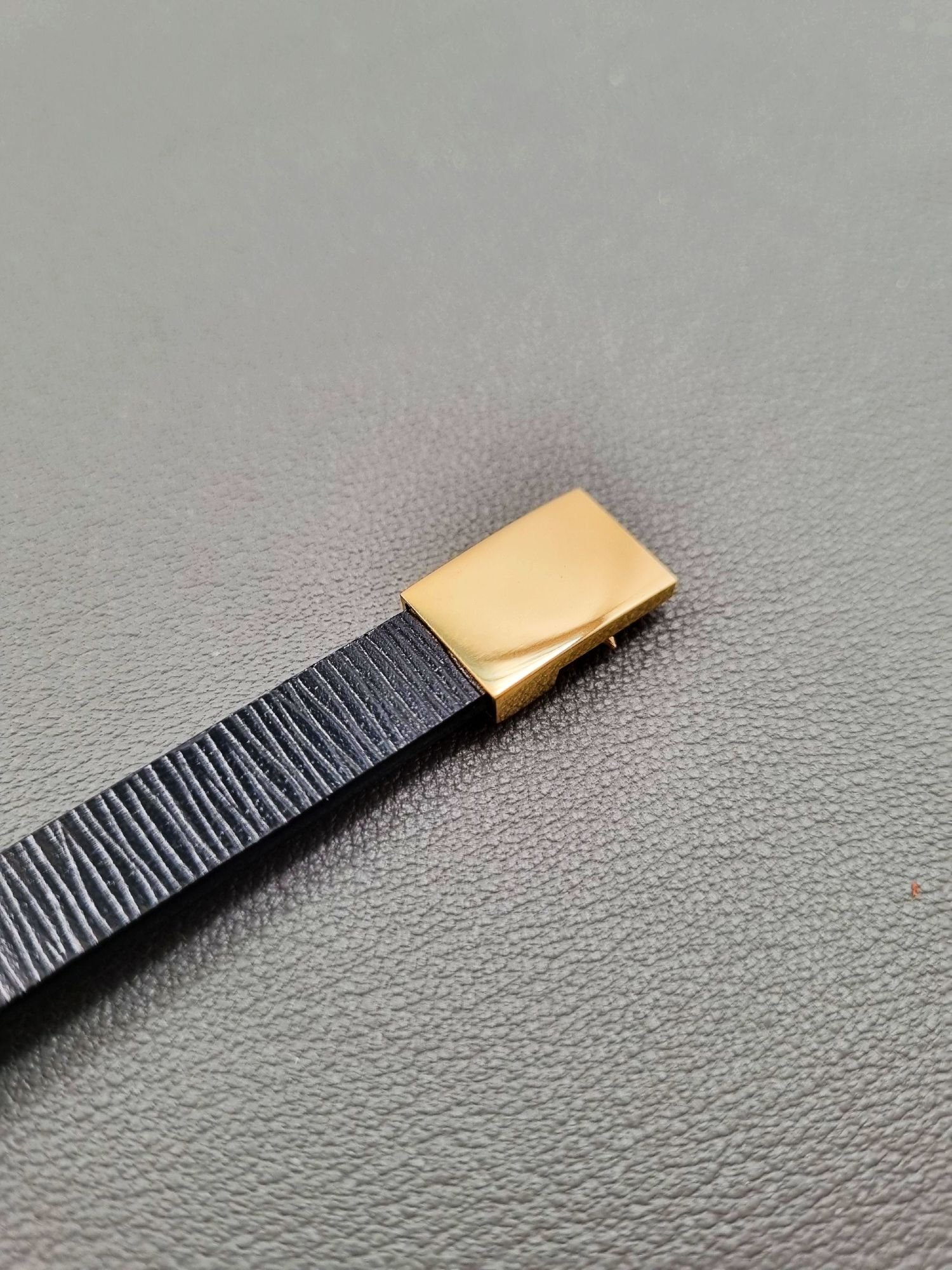 Black epi leather bracelet with a silver magnetic clasp, made by Pila Luxuria in Canada.