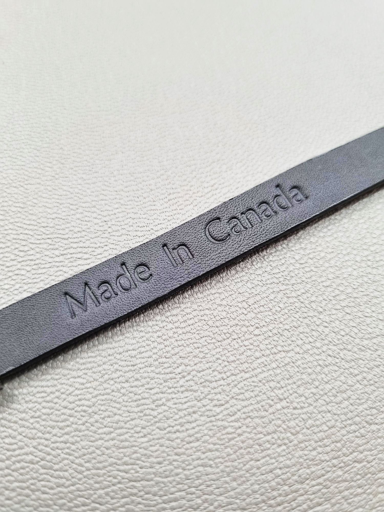 Made In Canada logo of a luxury black epi leather bracelet with a magnetic clasp, made by Pila Luxuria in Canada.