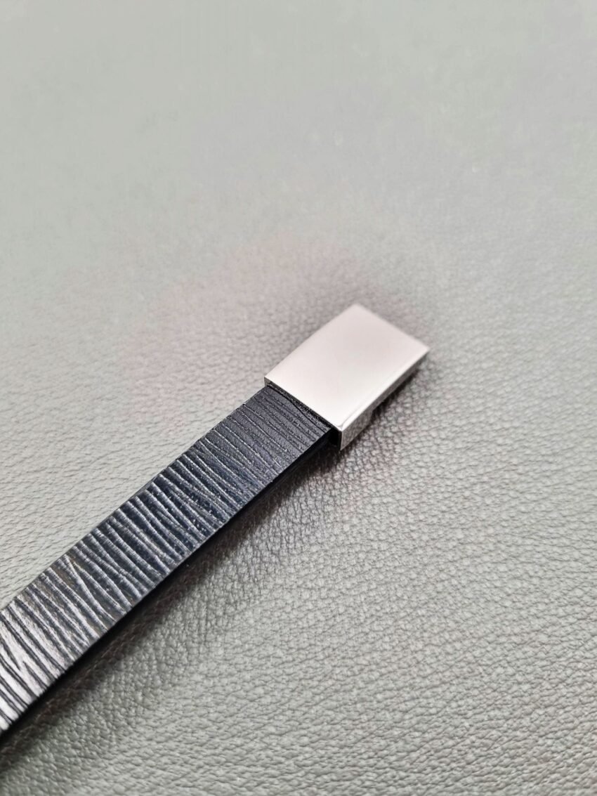 Black epi leather bracelet with a silver magnetic clasp, made by Pila Luxuria in Canada.