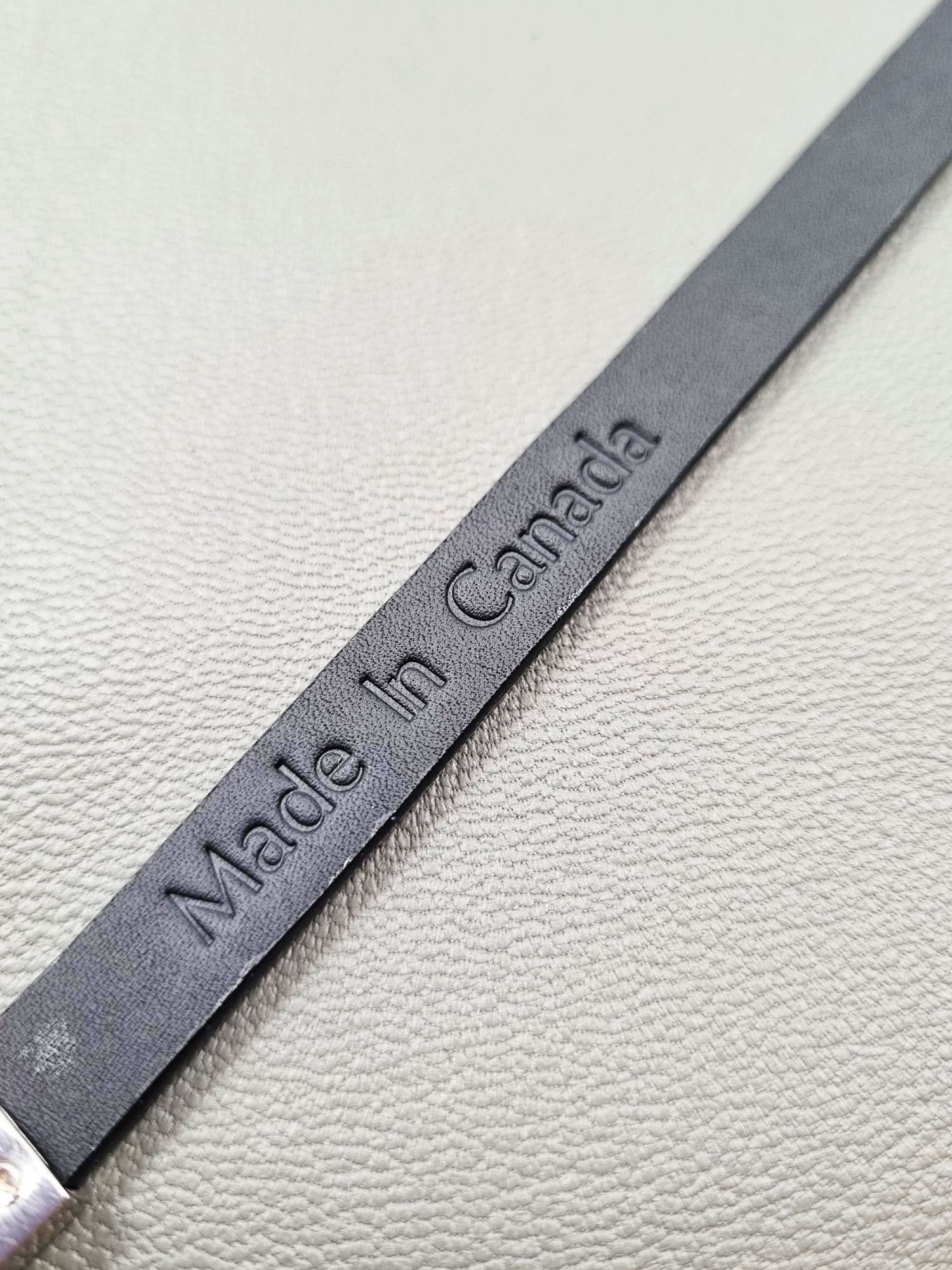 Made In Canada logo of a luxury tarnished python leather bracelet with a magnetic clasp, made by Pila Luxuria in Canada.