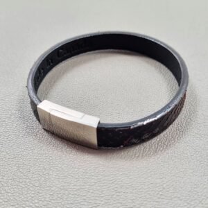 Top view of a luxury tarnished python leather bracelet with a magnetic clasp, made by Pila Luxuria in Canada.