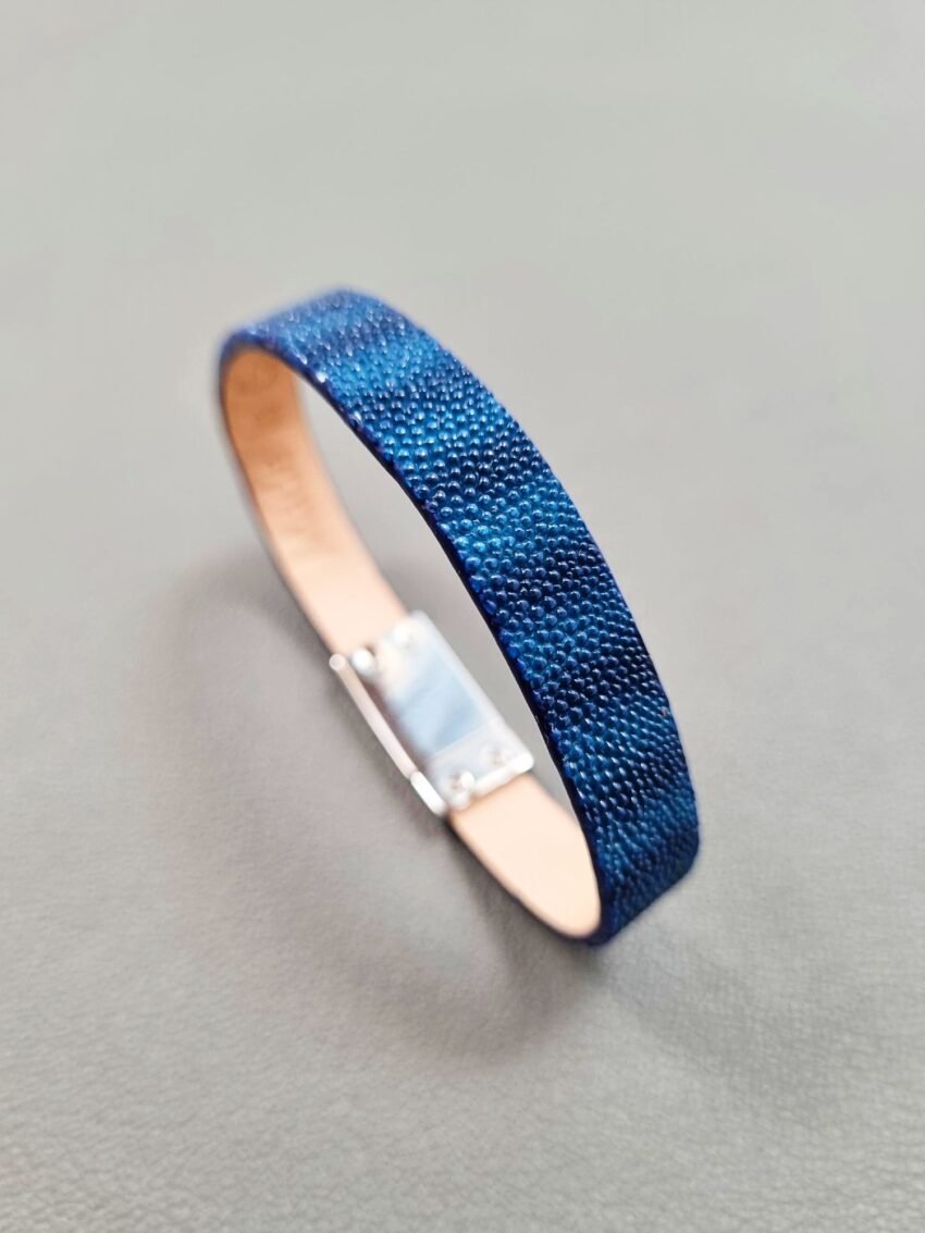 Angled view of a luxury blue stingray bracelet with a magnetic clasp, made by Pila Luxuria in Canada.