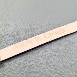 Embossed Made in Canada view of a luxury blue stingray bracelet with a magnetic clasp, made by Pila Luxuria in Canada.