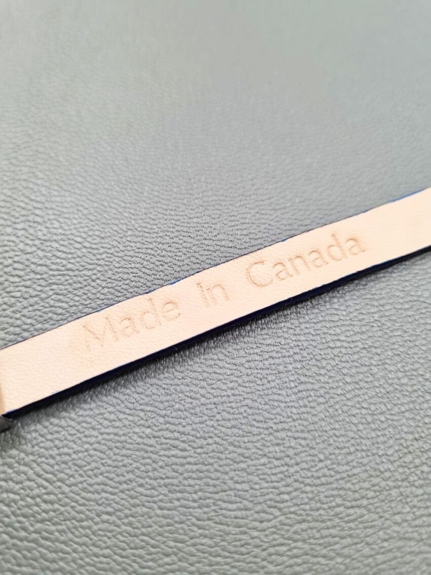 Embossed Made in Canada view of a luxury blue stingray bracelet with a magnetic clasp, made by Pila Luxuria in Canada.