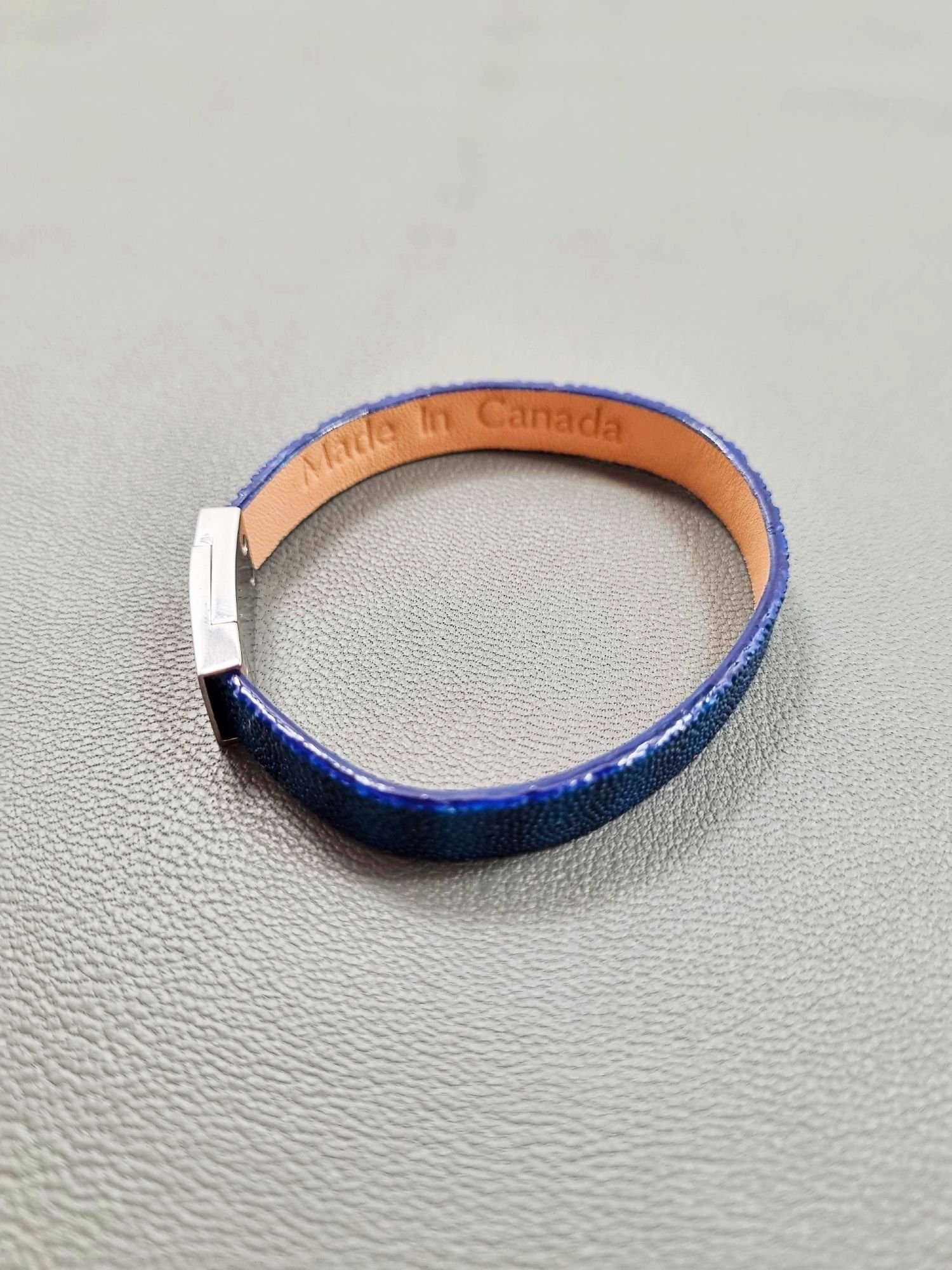 Top view of a luxury blue stingray bracelet with a magnetic clasp, made by Pila Luxuria in Canada.