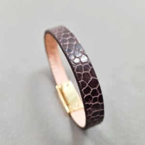 Angel view of a luxury brown ostrich leather bracelet with a magnetic clasp, made by Pila Luxuria in Canada.