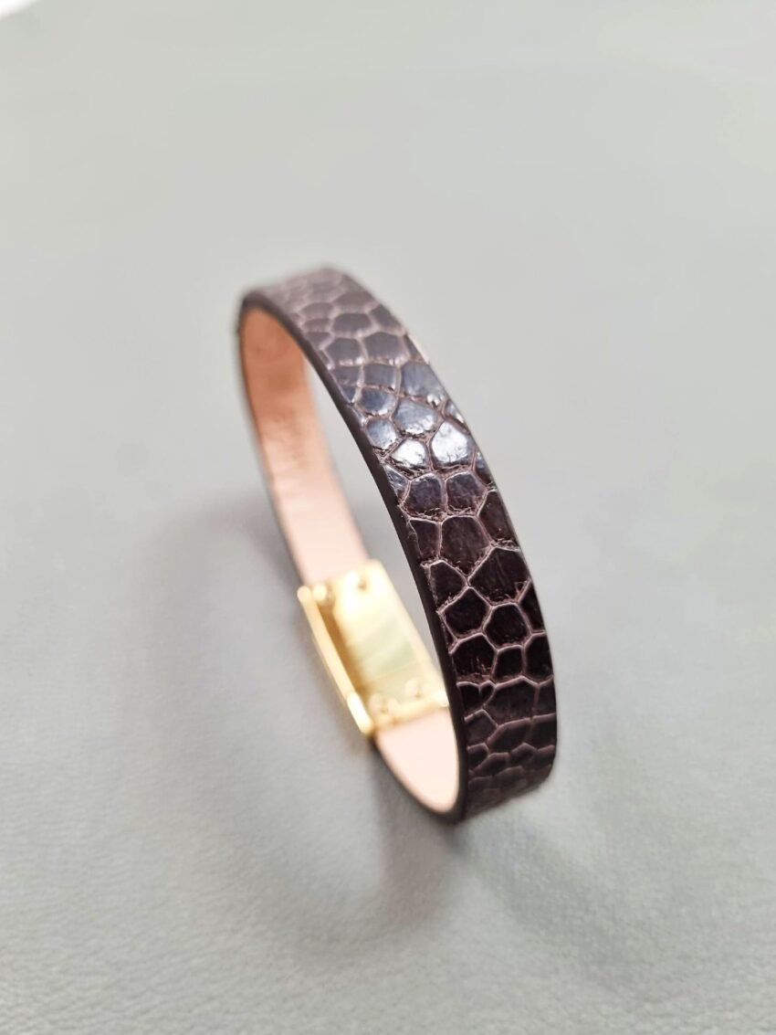 Angel view of a luxury brown ostrich leather bracelet with a magnetic clasp, made by Pila Luxuria in Canada.