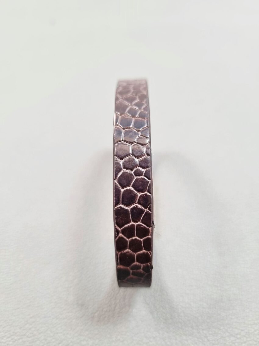 Forward view of a luxury brown ostrich leather bracelet with a magnetic clasp, made by Pila Luxuria in Canada.