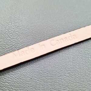 Made In Canada logo of a luxury brown ostrich leather bracelet with a magnetic clasp, made by Pila Luxuria in Canada.