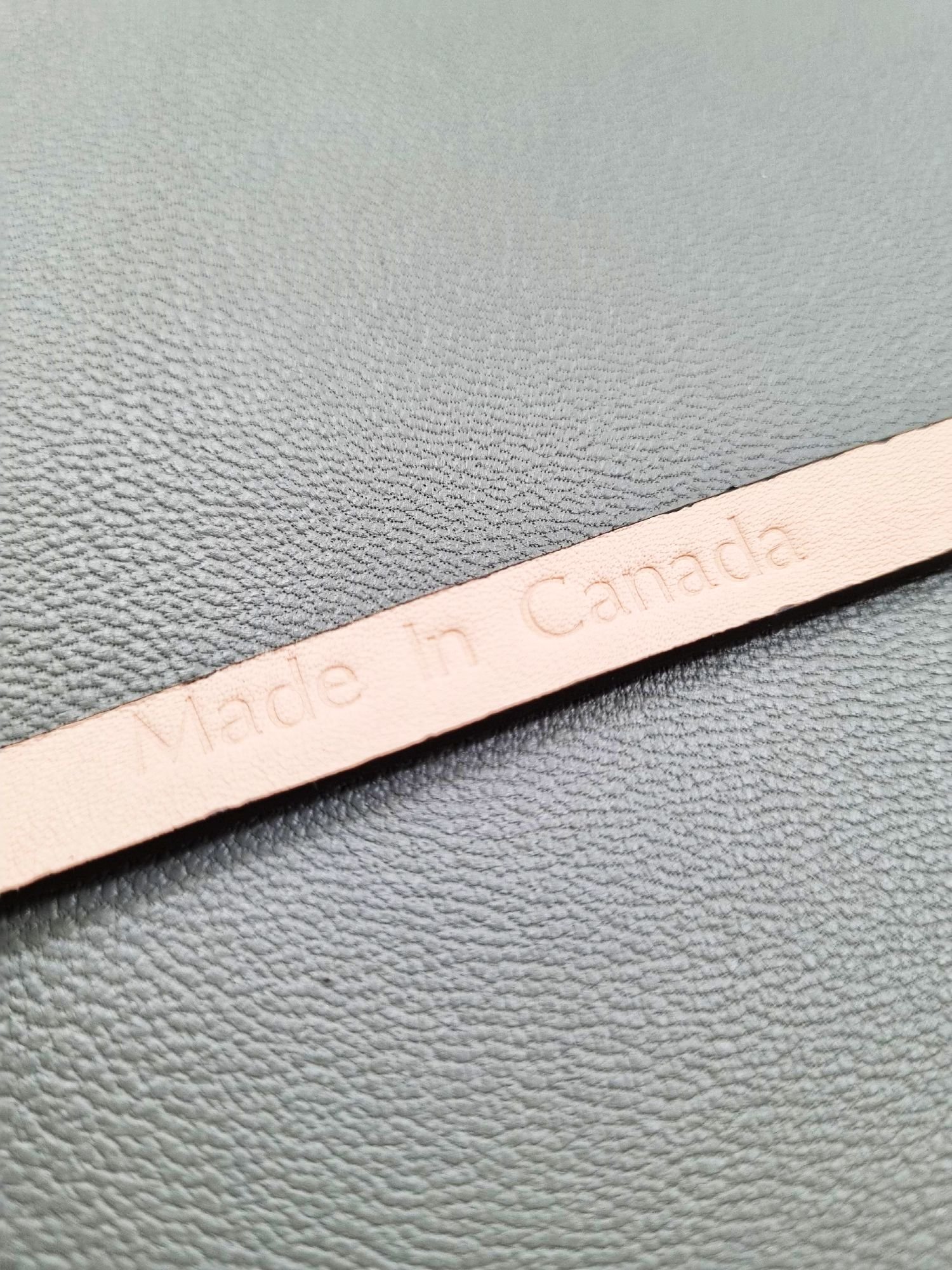 Made In Canada logo of a luxury brown ostrich leather bracelet with a magnetic clasp, made by Pila Luxuria in Canada.