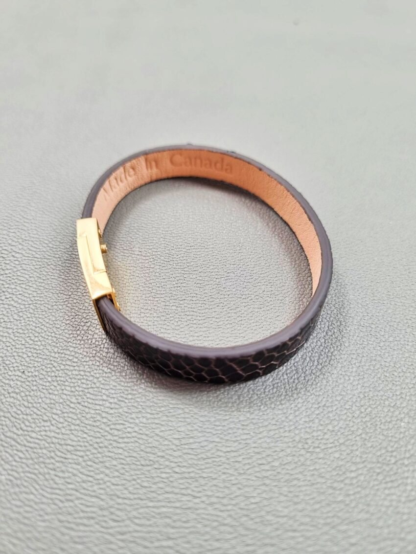 Top view of a luxury brown ostrich leather bracelet with a magnetic clasp, made by Pila Luxuria in Canada.