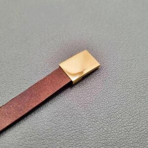 Brown calfskin leather bracelet with gold magnet clasp.