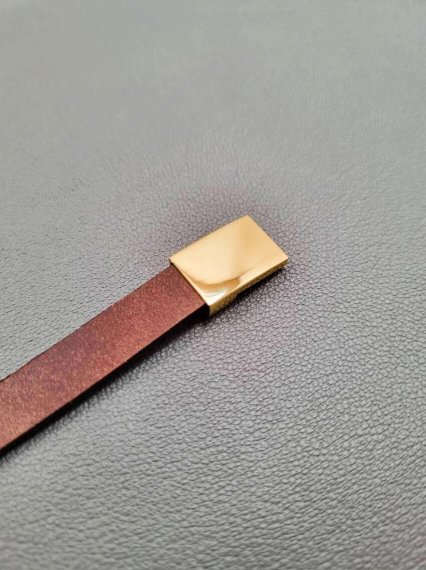 Brown calfskin leather bracelet with gold magnet clasp.