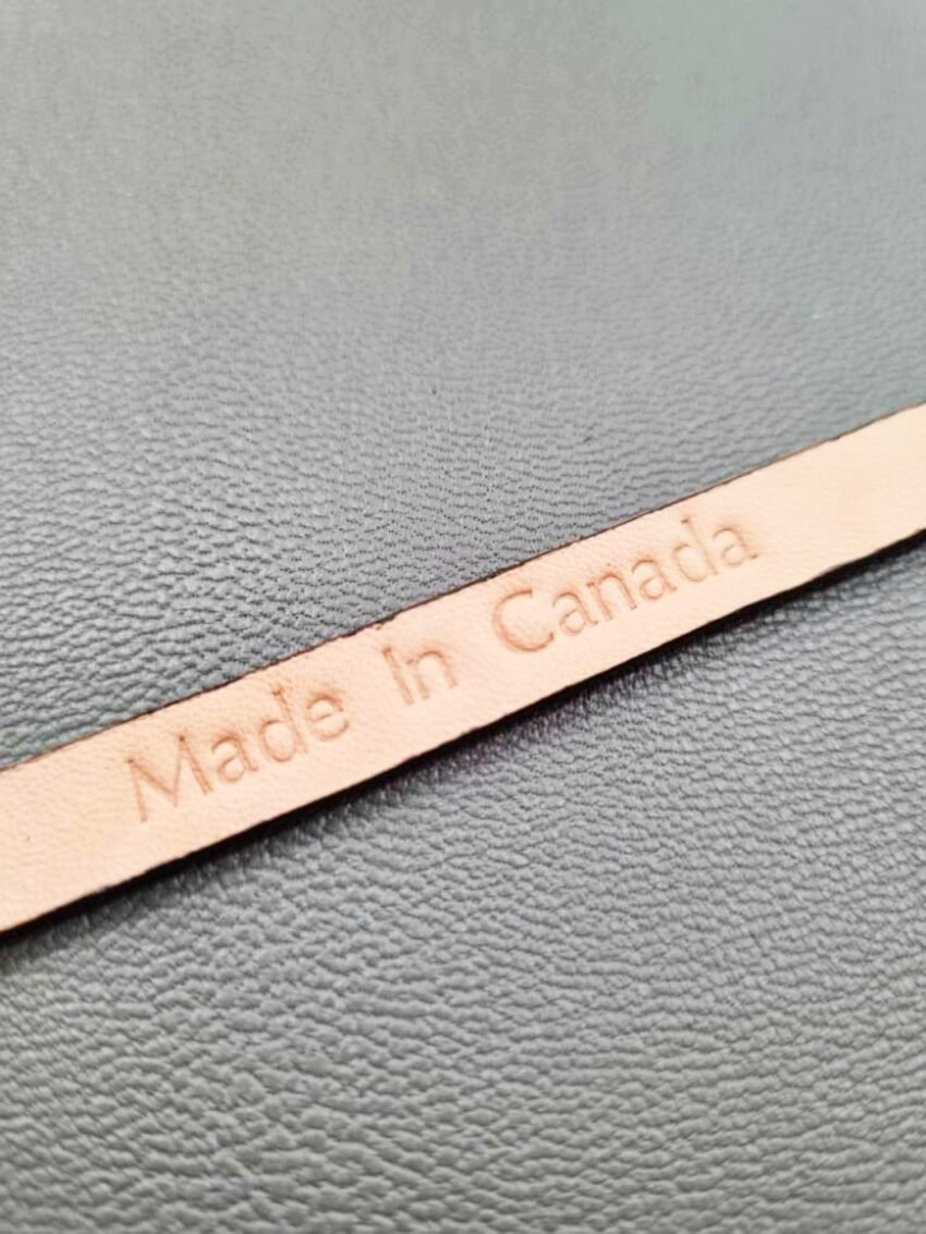 Embossed Made in Canada emblem of a luxury brown calfskin leather bracelet with a magnetic clasp, made by Pila Luxuria in Canada.