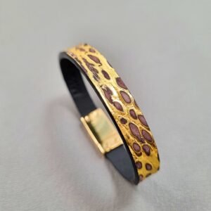 Angled view of a luxury brushed gold crocodile leather bracelet with a magnetic clasp, made by Pila Luxuria in Canada.