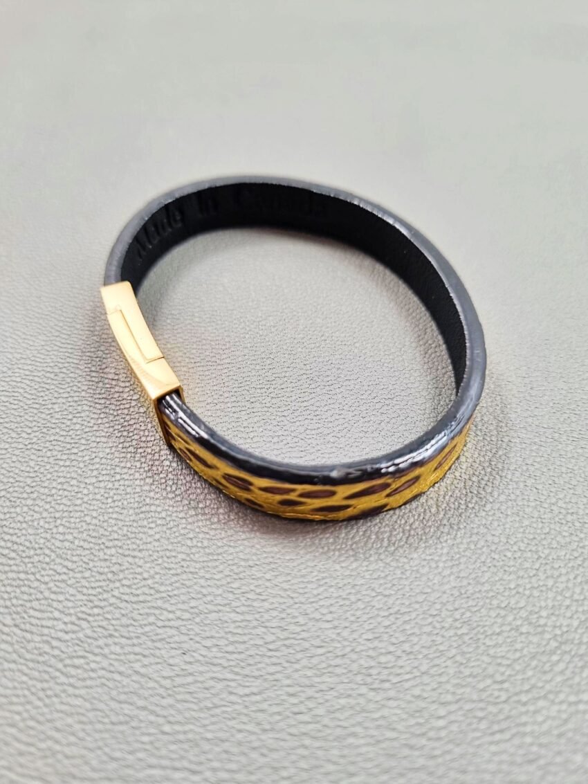 Top view of a luxury brushed gold crocodile leather bracelet with a magnetic clasp, made by Pila Luxuria in Canada.