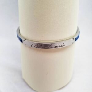 Logo of a luxury blue crocodile clasp bracelet, made by Pila Luxuria in Canada.