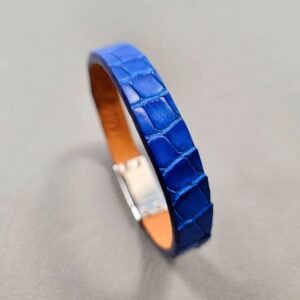 Angled view of a luxury cobalt crocodile leather bracelet with a magnetic clasp, made by Pila Luxuria in Canada.