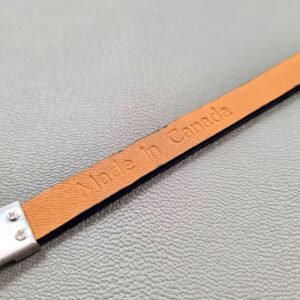 Embossed Made in Canada of a luxury cobalt crocodile leather bracelet with a magnetic clasp, made by Pila Luxuria in Canada.