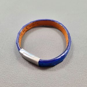 Top view of a luxury cobalt crocodile leather bracelet with a magnetic clasp, made by Pila Luxuria in Canada.