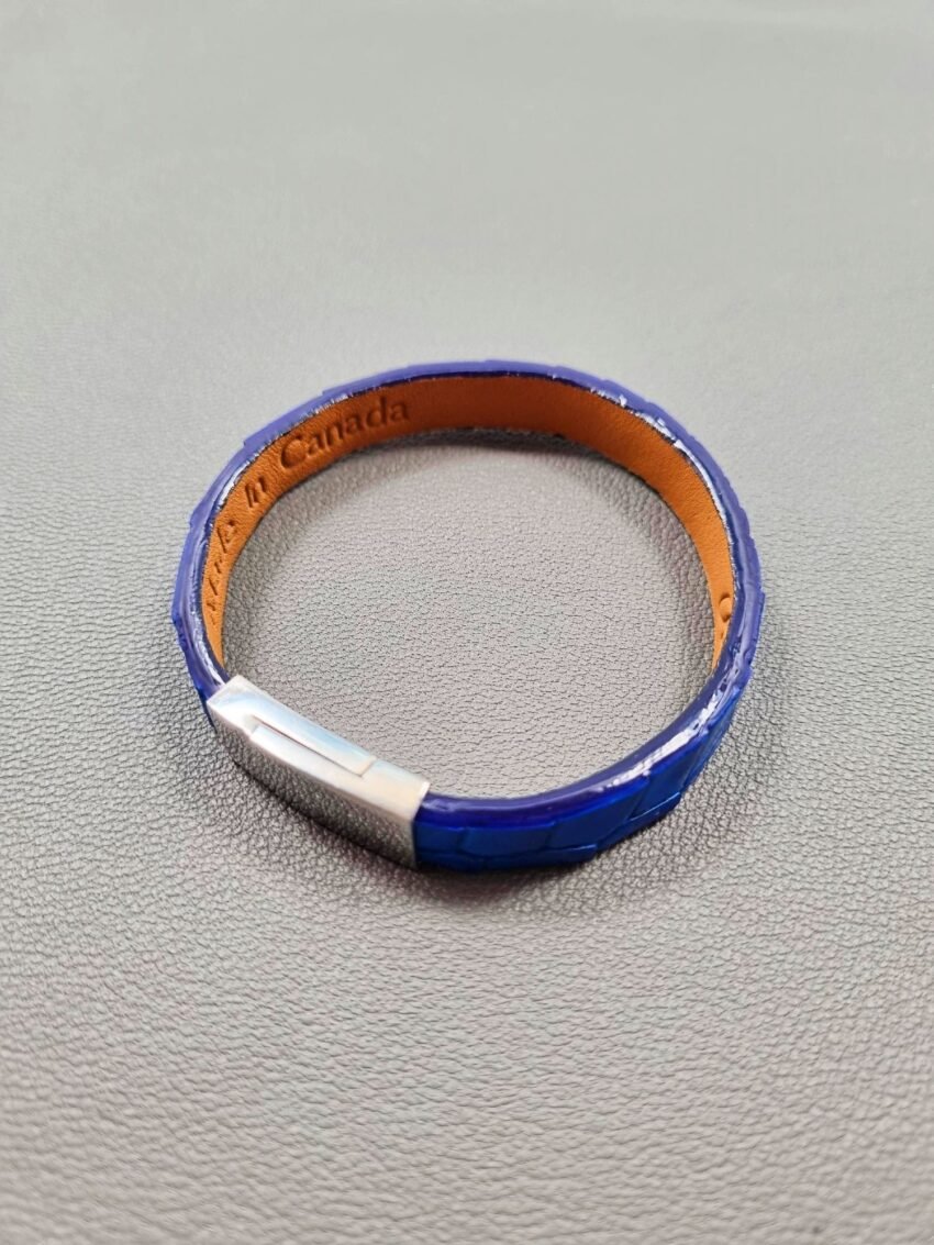 Top view of a luxury cobalt crocodile leather bracelet with a magnetic clasp, made by Pila Luxuria in Canada.