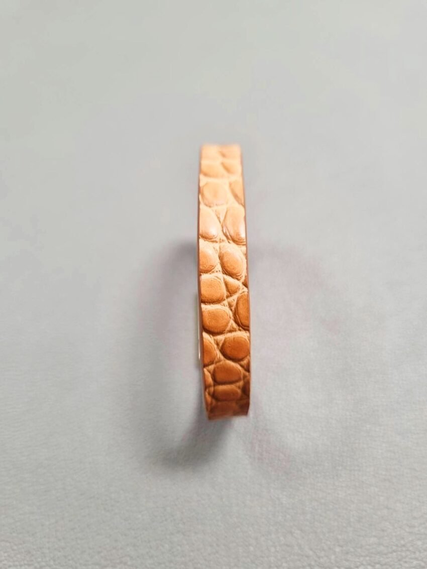 Front view of a luxury cognac crocodile bracelet with a magnetic clasp, made by Pila Luxuria in Canada.