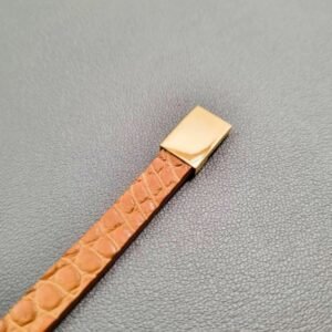 Cognac crocodile leather bracelet with a gold magnetic clasp, made by Pila Luxuria in Canada.