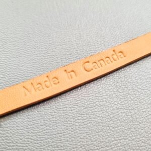 Made In Canada embossed on a luxury cognac crocodile bracelet with a magnetic clasp, made by Pila Luxuria in Canada.